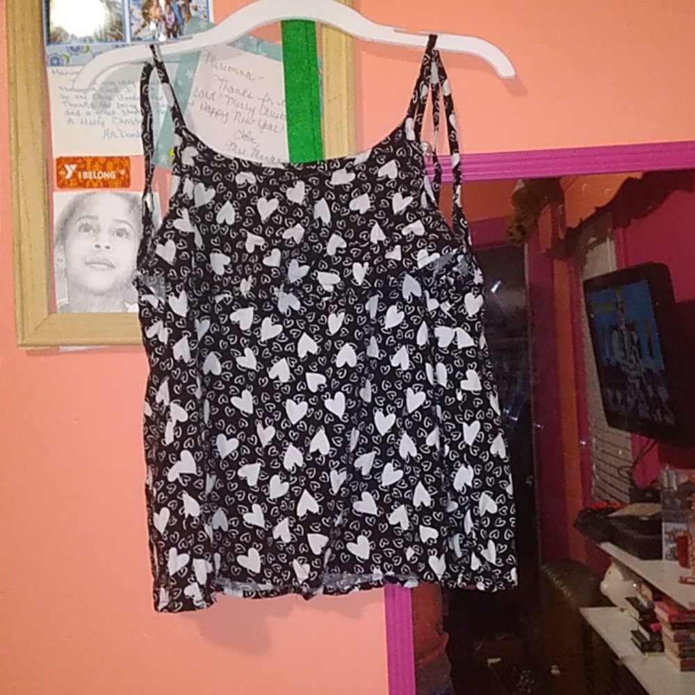 A black and white heart tank top shirt